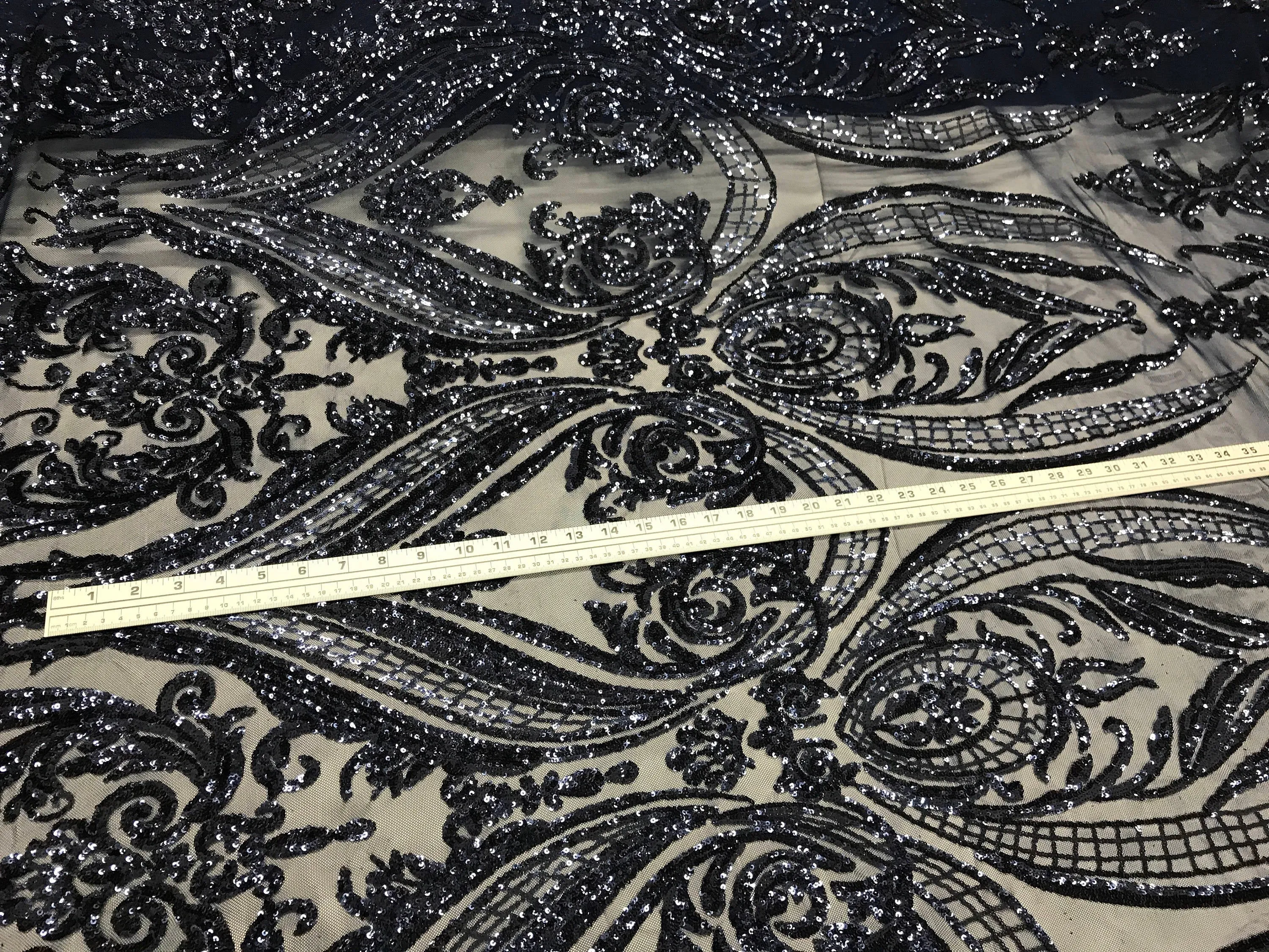 Navy blue empire design with sequins embroider on a 4 way stretch mesh fabric-sold by the yard.